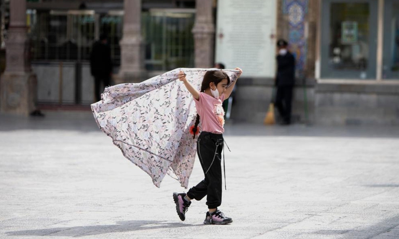 A girl plays at the shrine of Shah Abdulazim during the holy month of Ramadan in Shahr-e Rey, south of Tehran, Iran, April 19, 2021. Photo: Xinhua