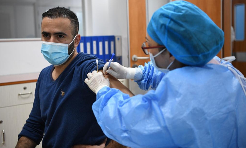 A Tunisian national receives a dose of COVID-19 vaccine at a hospital in Yuexiu District of Guangzhou, south China's Guangdong Province, April 15, 2021.Photo:Xinhua