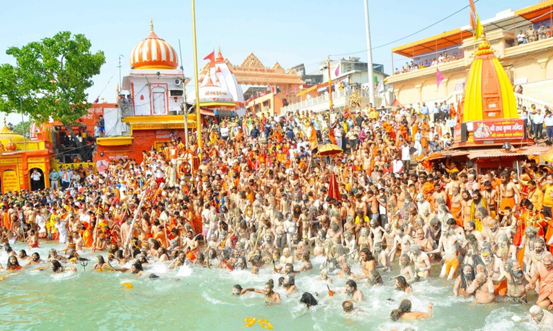 People taking holy dip at river Ganga during Kumbh festival in Haridwar, India on April 14, 2021.(Photo: Xinhua)