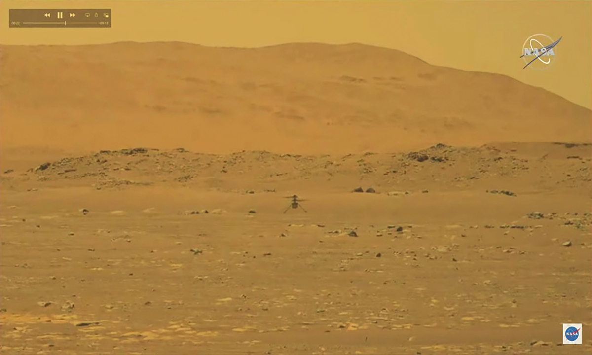 A handout video taken from a livestream by NASA shows NASA's Ingenuity Mars Helicopter during its first test flight, as seen by NASA's Perseverance Rover, on Mars, on Monday. According to NASA, Ingenuity has successfully performed a short flight on Mars, the first ever helicopter flight on another planet.  Photo: IC