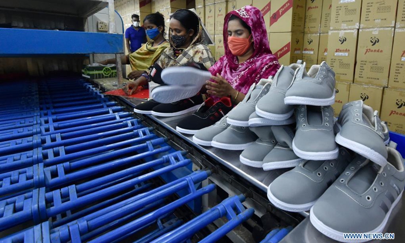 Workers make shoes at the factory of Panda Shoes Industries Ltd. in Gazipur on the outskirts of Dhaka, Bangladesh, April 4, 2021. Thousands of households in the Gazipur District on the outskirts of the Bangladeshi capital Dhaka have become better off after a Chinese-invested shoemaking factory opened there in 2012. Panda Shoes Industries Ltd. has not only brought investment and development opportunities to the Gazipur District, but also provided jobs at villagers' doorsteps.(Photo: Xinhua)