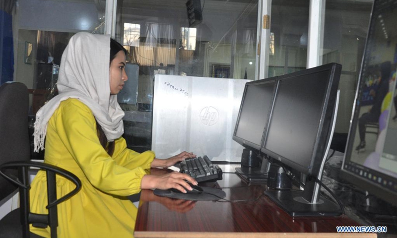 An Afghan female journalist works at the radio-television channel Ghazal in Shiberghan city, capital of Jawzjan province, Afghanistan, April 7, 2021.(Photo: Xinhua)