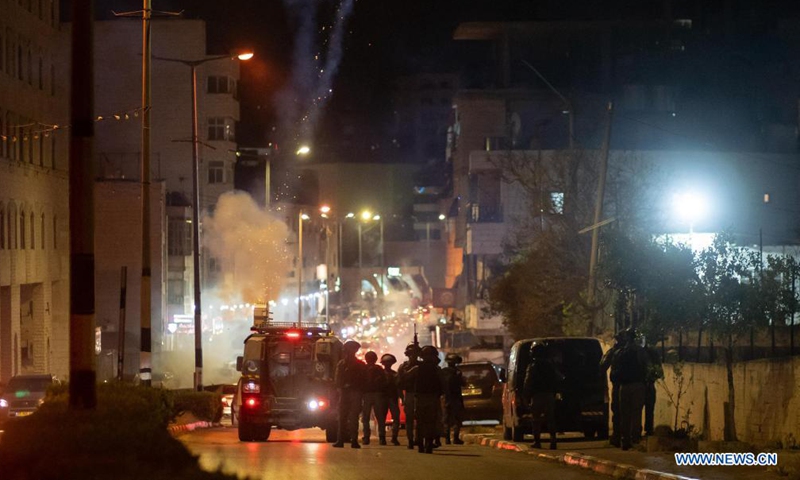 An Israeli vehicle shoots tear gas canisters at Palestinians during clashes in the West Bank city of Bethlehem, on April 23, 2021. Clashes erupted in Bethlehem and Ramallah amid tensions following clashes in Jerusalem between Palestinians and right-wing Israeli extremists.Photo:Xinhua