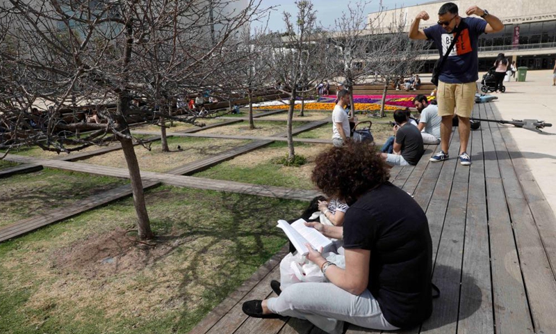 A woman reads a book on World Book Day in Tel Aviv, Israel, on April 23, 2021. Photo:Xinhua
