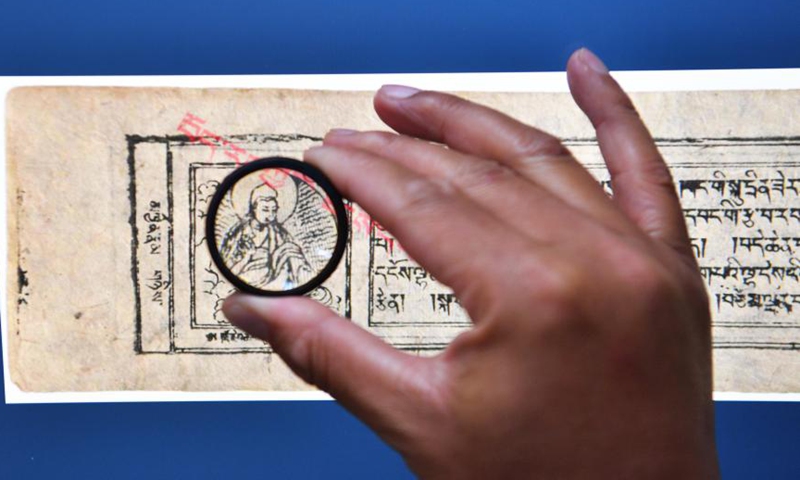 A researcher reads historical files about Tibetan culture on an online platform under the official website of the Tibet Library in Lhasa, southwest China's Tibet Autonomous Region, April 20, 2021.Photo:Xinhua