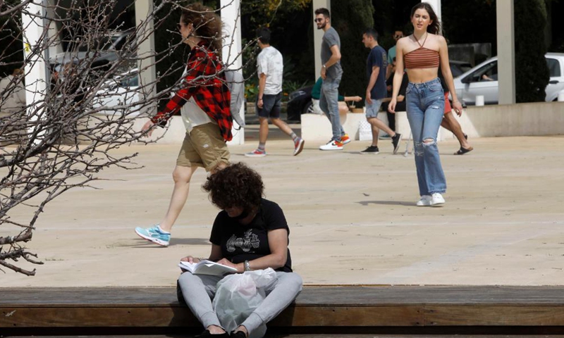 A woman reads a book on World Book Day in Tel Aviv, Israel, on April 23, 2021.Photo:Xinhua