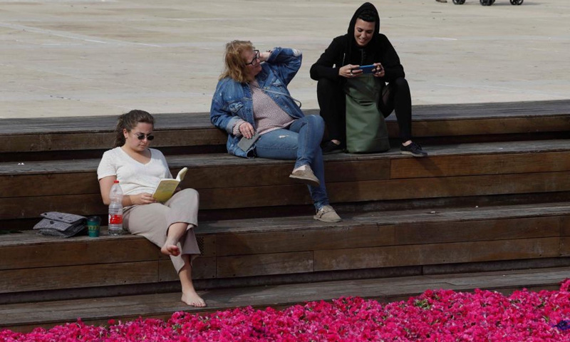 A woman reads a book on World Book Day in Tel Aviv, Israel, on April 23, 2021.Photo:Xinhua