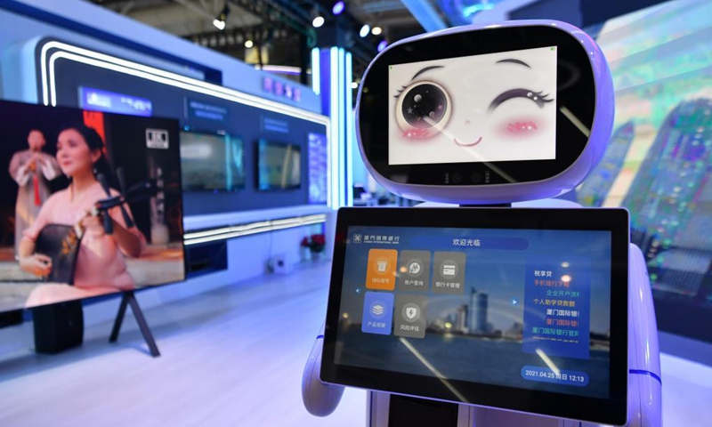 A robot belonging to Xiamen International Bank is seen at the digital achievements exhibition during the fourth Digital China Summit in Fuzhou, southeast China's Fujian Province, April 25, 2021. (Photo: Xinhua)