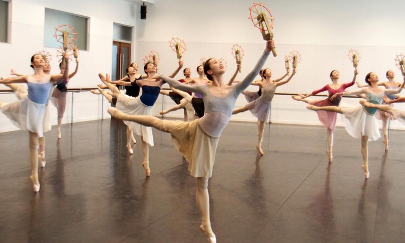 Dancers of Shanghai Ballet participate in a rehearsal of the originally created ballet performance The Burning Youth in east China's Shanghai, April 26, 2021. (Xinhua/Ren Long) 