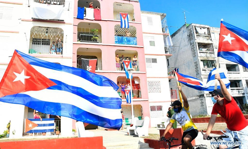 People paticipate in a rally against U.S. embargo in Santa Clara, Cuba, April 25, 2021. Thousands of people participated in rallies in different cities across Cuba on Sunday, demanding an end to the six-decade U.S. embargo on the island.(Photo: Xinhua)