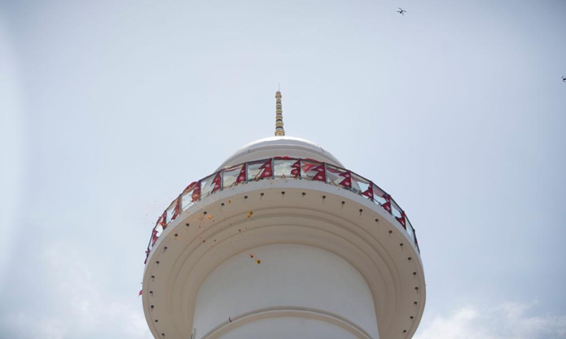 Photo taken on April 24, 2021 show the newly-built Dharahara in Kathmandu, Nepal. Located in Kathmandu and built in 1832, the nine-storey Dharahara Tower is part of the city's historical architecture recognized by UNESCO. Most of the tower collapsed on April 25, 2015 during the massive earthquake although the base remains. The reconstruction work started in 2018 and the newly-built Dharahara was inaugurated on April 24.(Photo: Xinhua)