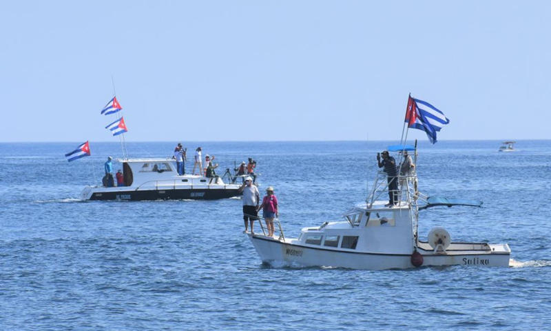 People in boats paticipate in a rally against US embargo in Havana, Cuba, April 25, 2021. Thousands of people participated in rallies in different cities across Cuba on Sunday, demanding an end to the six-decade U.S. embargo on the island.(Photo: Xinhua)