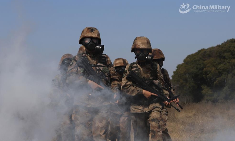 Members assigned to a female unmanned aerial vehicle (UAV) detachment under the PLA 72nd Group Army march with full combat gear during a training exercise in early April, 2021. The training involved such items as emergency flight preparation, reconnaissance and confrontation of the drones under high altitude and adverse weather conditions in strange areas. (eng.chinamil.com.cn/Photo by Huang Baochuan and Zhang Linyu)
