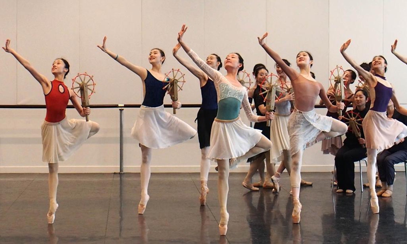 Dancers of Shanghai Ballet participate in a rehearsal of the originally created ballet performance The Burning Youth in east China's Shanghai, April 26, 2021. (Xinhua/Ren Long) 