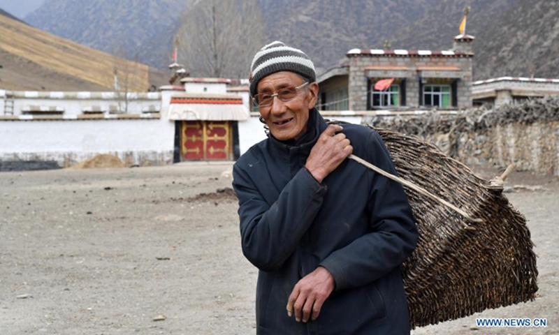Tsering poses for a portrait at home in Nyinzhung Township of Damxung County, Lhasa City of southwest China's Tibet Autonomous Region, April 16, 2021. Tsering, born in 1944 as a herdsman in Nyinzhung Township, recalls the old times in Tibet when heavy and various duties in pasture area squeezed the life of local people.(Photo:Xinhua)
