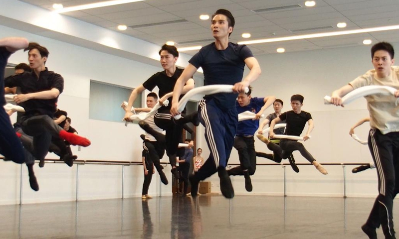 Dancers of Shanghai Ballet participate in a rehearsal of the originally created ballet performance The Burning Youth in east China's Shanghai, April 26, 2021. (Xinhua/Ren Long) 