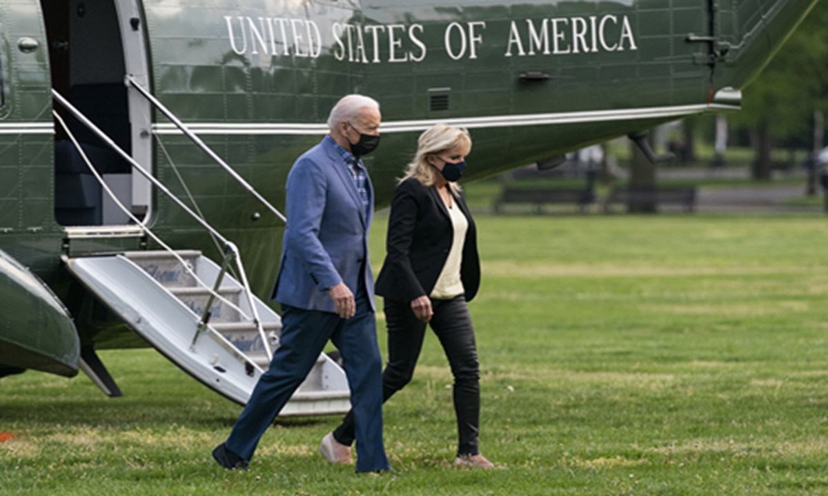President Joe Biden walks from Marine One with first lady Jill Biden on the Ellipse near the White House after spending the weekend in Wilmington, Del., on Sunday in Washington. Photo: VCG