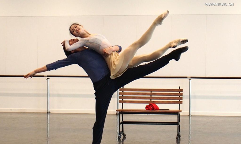 Dancers of Shanghai Ballet participate in a rehearsal of the originally created ballet performance The Burning Youth in east China's Shanghai, April 26, 2021. (Xinhua/Ren Long) 