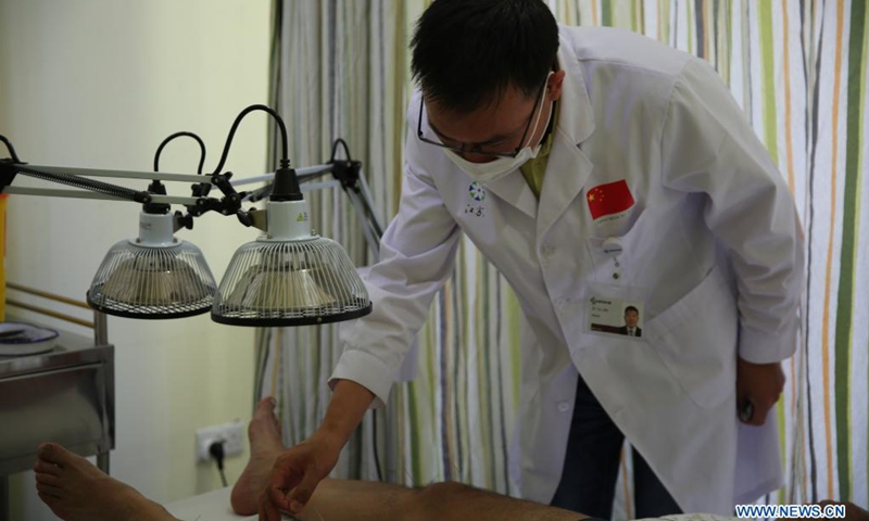 Dr. Xu Lifei, a member of the 16th China medical team for Malta, conducts acupuncture for a patient at the Mediterranean Regional Center for Traditional Chinese Medicine (MRCTCM) in Paola, Malta, April 27, 2021. The MRCTCM was officially established in 1994 as a partnership between the Chinese and Maltese governments.(Photo: Xinhua)