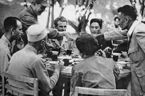 The northwest China visiting team of Chinese and foreign reporters were invited to a dinner at the Headquarters of the Eighth Route Army at the Wangjiaping Peach Orchard in June 1944