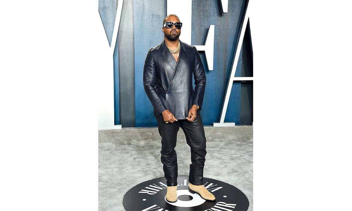 Kanye West and Inset: A pair of Nike Air Yeezy 1s Photos: IC