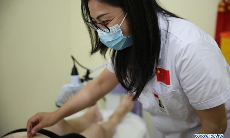 Dr. Jiang Yawen, team leader of the 16th China medical team for Malta, conducts acupuncture for a patient at the Mediterranean Regional Center for Traditional Chinese Medicine (MRCTCM) in Paola, Malta, April 27, 2021. The MRCTCM was officially established in 1994 as a partnership between the Chinese and Maltese governments.(Photo: Xinhua)