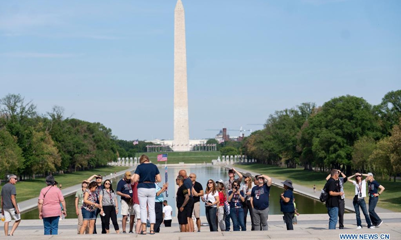 People tour the Nation Mall near the Lincoln Memorial Reflecting Pool in Washington, D.C., the United States, on April 27, 2021. The U.S. Centers for Disease Control and Prevention (CDC) unveiled new guidelines for fully vaccinated Americans on Tuesday, including activities they can safely resume without wearing masks.(Photo: Xinhua)