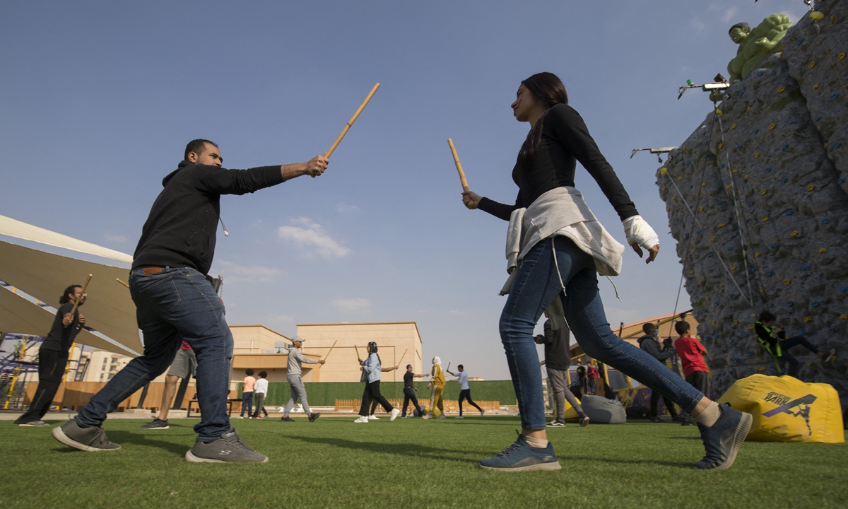 People take part in a training session for Egypt's combative sport <em>tahtib</em> at a sports club in Cairo on March 18. Photo: AFP