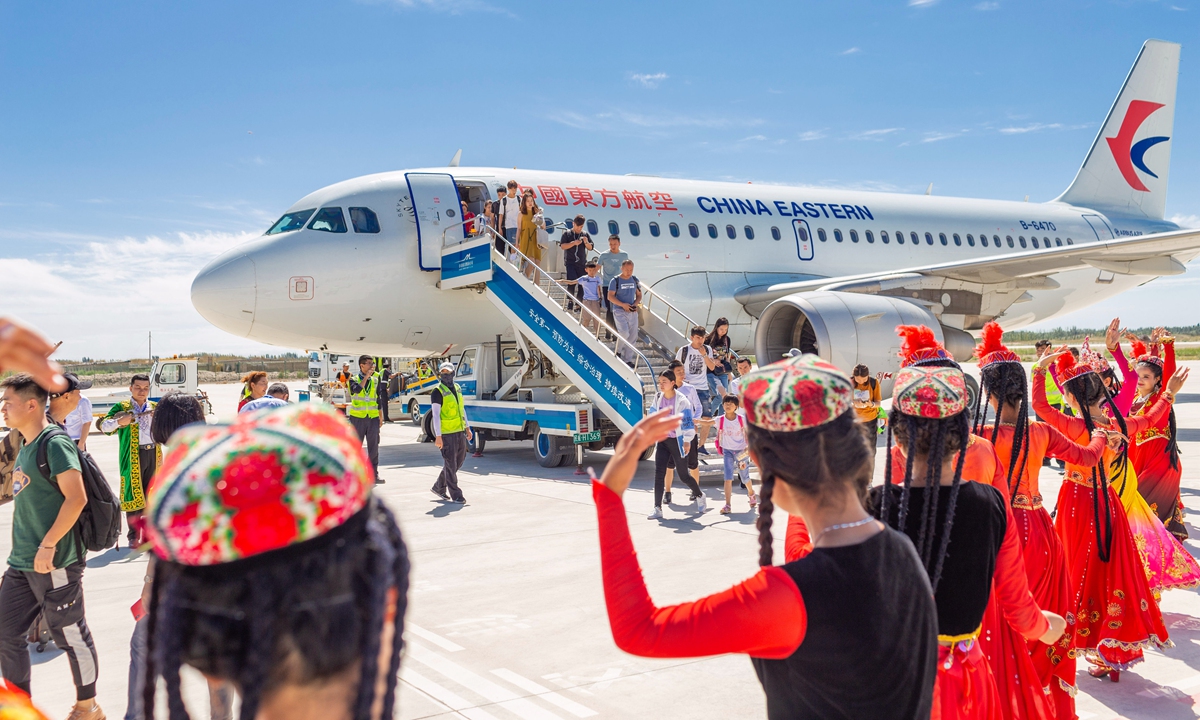 People in Kuqa county in Xinjiang hold a warm welcome ceremony for tourists with singing and dancing on July 11, 2019. Photo: IC