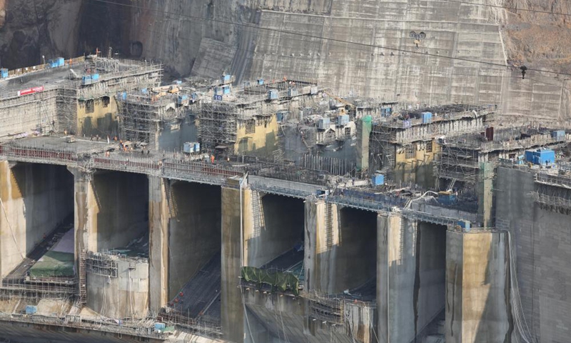 Workers are busy at the construction site of the Baihetan hydropower station in southwest China, April 27, 2021.Photo:Xinhua