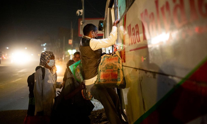 People travel in the long route bus to go back to their village prior to lockdown imposed to curb the COVID-19 infections in Kathmandu, Nepal, April 28, 2021.Photo:Xinhua