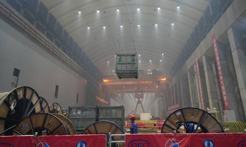 Workers are busy at the construction site of the Baihetan hydropower station in southwest China, April 27, 2021.Photo:Xinhua