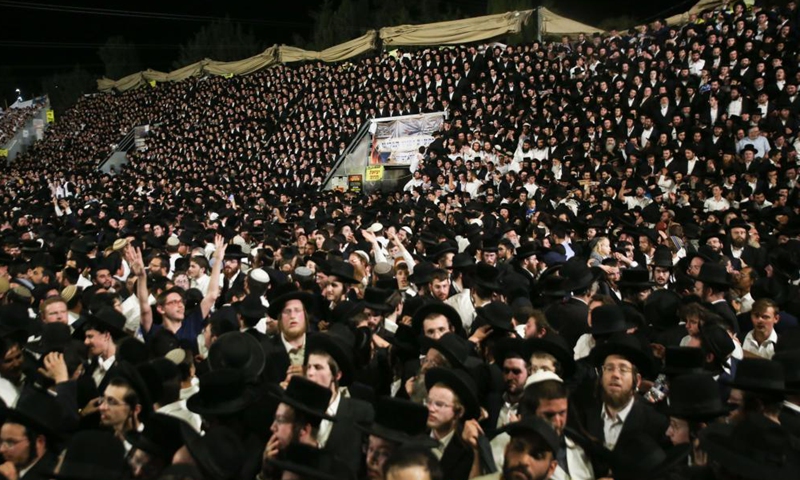 People gather and celebrate the Jewish holiday of Lag BaOmer on Mount Meron, Israel, April 29, 2021. At least 44 people were killed and 103 injured in a stampede after midnight Thursday at an Israeli festival attended by tens of thousands of people, local media reported. The tragedy happened in Mount Meron in northern Israel, during the festival celebrated every year on the eve of the Jewish holiday Lag BaOmer.Photo:Xinhua