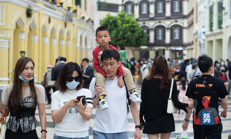 Tourists visit the Senado Square in south China's Macao, on May 3, 2021, the third day of China's five-day May Day holiday. (Xinhua/Cheong Kam Ka)