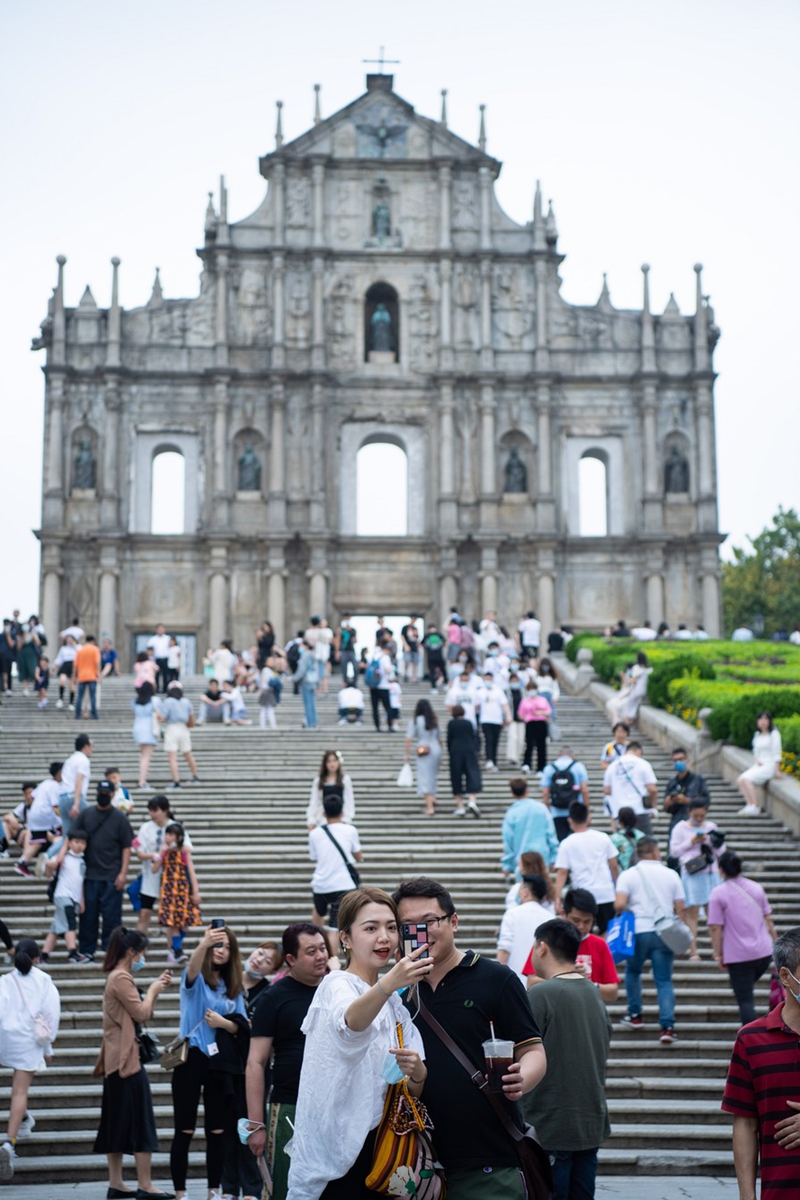 Tourists visit the Ruins of St. Paul's in south China's Macao, on May 3, 2021, the third day of China's five-day May Day holiday. (Xinhua/Cheong Kam Ka)