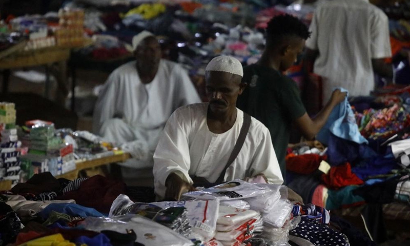 Vendors wait for customers at a market in Khartoum, Sudan, May 5, 2021. Eid Al-Fitr, also called the festival of breaking the fast that marks the end of the month-long dawn-to-sunset fasting of Ramadan, is celebrated by Muslims worldwide. Photo: Xinhua