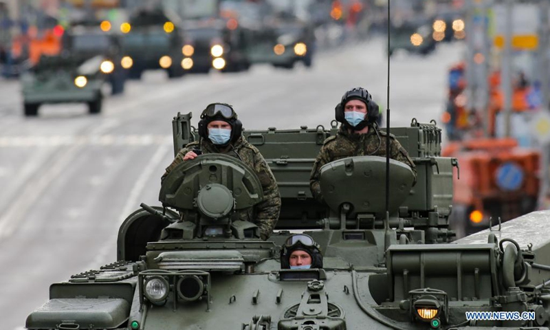 Soldiers are seen on a military vehicle before a rehearsal of the Victory Day parade in Moscow, Russia, on May 4, 2021. Russia holds Victory Day parades in various cities on May 9.(Photo: Xinhua)