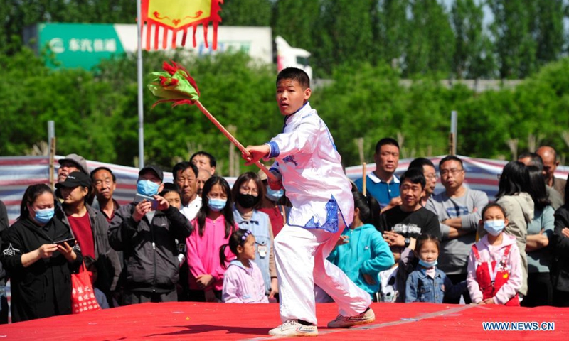 A martial artist performs in Suning County of Cangzhou City, north China's Hebei Province, May 2, 2021. Official data showed 230 million domestic tourist trips were made during the five-day Labor Day holiday, up 119.7 percent from last year.(Photo: Xinhua)