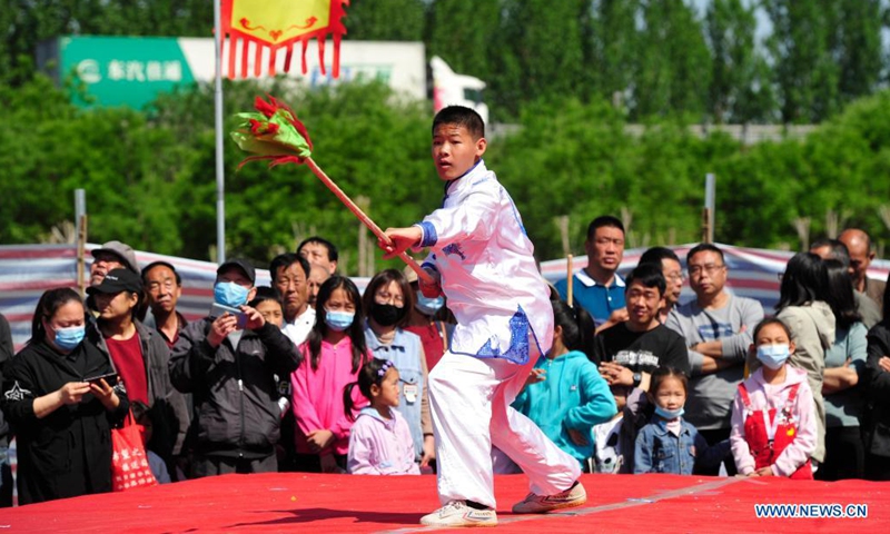 A martial artist performs in Suning County of Cangzhou City, north China's Hebei Province, May 2, 2021. Official data showed 230 million domestic tourist trips were made during the five-day Labor Day holiday, up 119.7 percent from last year.(Photo: Xinhua)