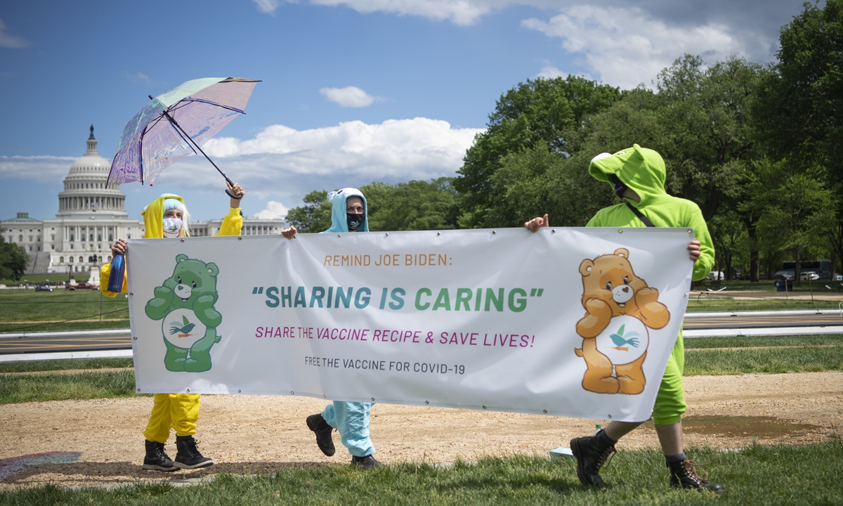 Activists dressed in Care Bears costumes hold a sign during a rally on the National Mall in Washington on Wednesday, to call on President Joe Biden to share the process of producing COVID-19 vaccines with the world and commit to a plan for global vaccine access. Photo: VCG