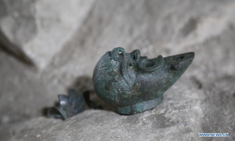 Photo taken on May 5, 2021 shows an 1,900-year-old half-faced oil lamp uncovered during excavations in the ancient Pilgrimage Road at the City of David archaeological site in Jerusalem. TO GO WITH Israel discovers 1,900-year-old half-faced oil lamp meant for luck.(Photo: Xinhua)