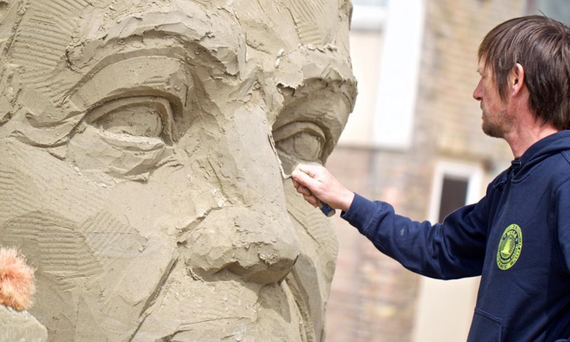 An artist works on a sand sculpture during the European Sand Sculpture Championships in Zandvoort, the Netherlands, May 6, 2021. The European Sand Sculpture Championship is staged in Zandvoort for the tenth time.Photo:Xinhua