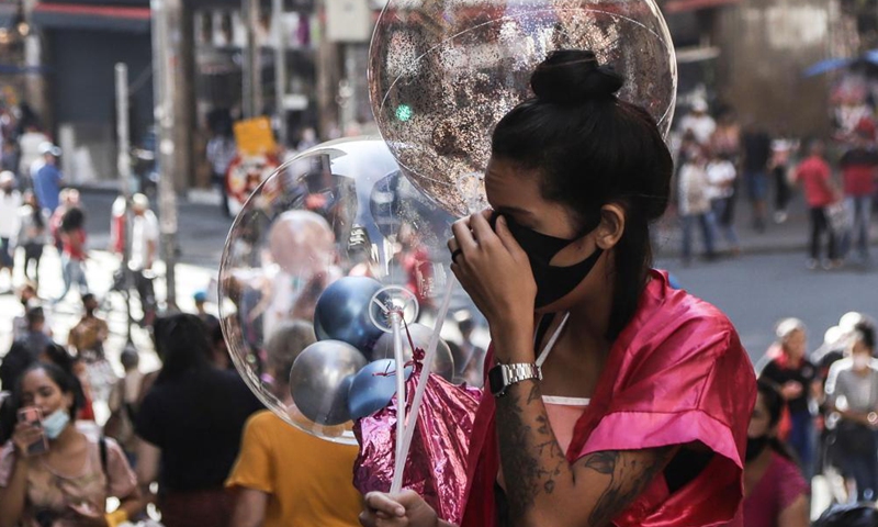 A woman holding balloons is seen amid COVID-19 outbreak in Sao Paulo, Brazil, on May 6, 2021.Photo:Xinhua