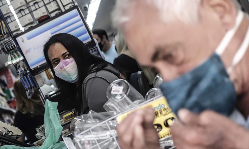 A consumer is seen in a shop amid COVID-19 outbreak in Sao Paulo, Brazil, on May 6, 2021.Photo:Xinhua