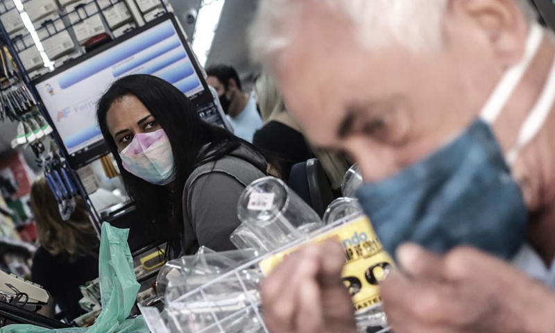 A consumer is seen in a shop amid COVID-19 outbreak in Sao Paulo, Brazil, on May 6, 2021.Photo:Xinhua