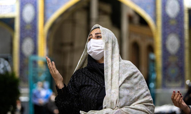 A woman wearing a face mask attends a Laylat al-Qadr night prayer during the holy fasting month of Ramadan in Emamzadeh Saleh mosque in Tehran, Iran, on May 6 , 2021. Photo:Xinhua