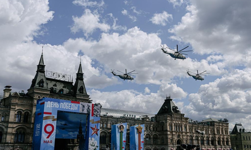 Helicopters fly over the Red Square during a rehearsal of the Victory Day parade in Moscow, Russia, May 7, 2021. Russia will hold military parades across the country to commemorate the 76th anniversary of the Soviet victory in the Great Patriotic War on May 9.Photo:Xinhua
