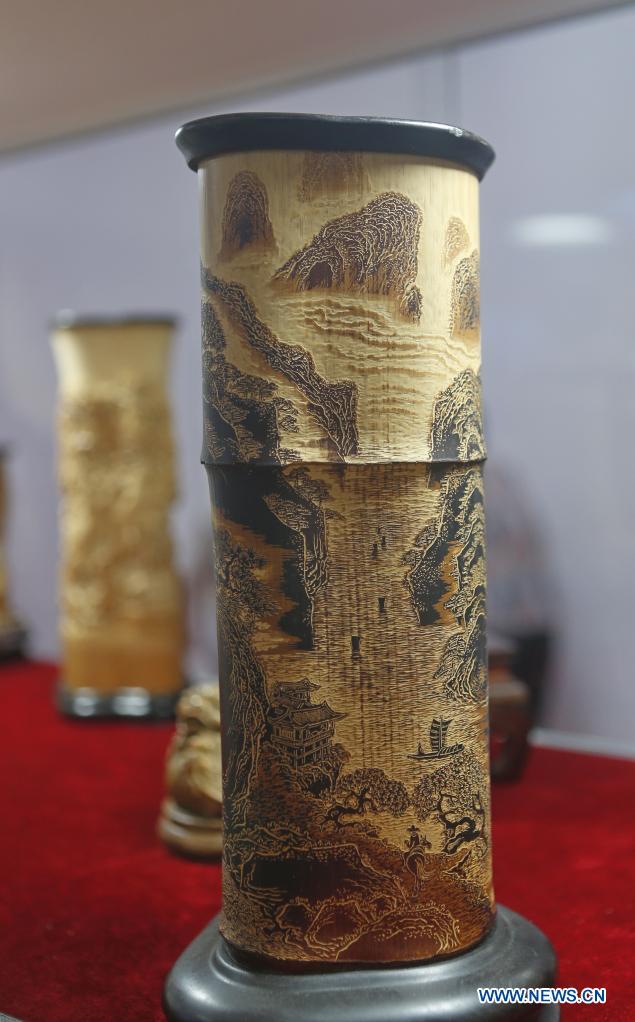 Photo taken on May 9, 2021 shows carved-bamboo pen containers on display during the first China International Consumer Products Expo in Haikou, capital of south China's Hainan Province. Domestic exhibits with Chinese characteristics are quite a sight at the Expo, not only meeting the needs of consumers, but also reflecting the unique charm of Chinese culture.  Photo: Xinhua