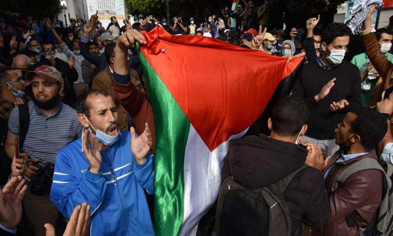 People wave Palestine flags and shout slogans during a rally supporting Palestine, in Rabat, Morocco, on May 10, 2021. Hundreds of demonstrators on Monday voiced their solidarity with the Palestinian people. Photo: Xinhua