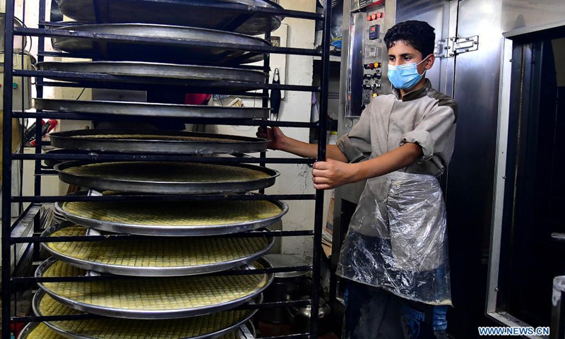 A sweet maker prepares traditional Syrian sweets for the upcoming Eid al-Fitr in Damascus, Syria, on May 9, 2021. Eid al-Fitr marks the end of the Islamic holy month of Ramadan.(Photo: Xinhua)